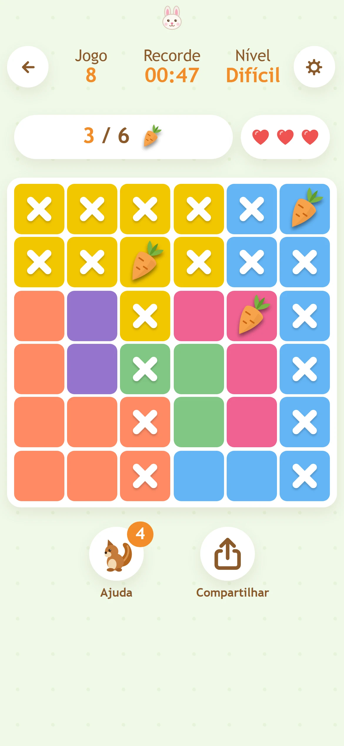 Tabuleiro do Karotto: cenouras e X em um jogo em andamento